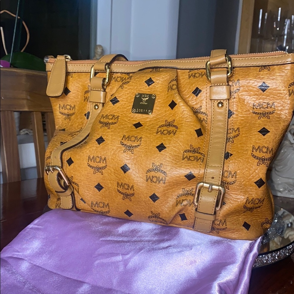 MCM Tan Cognac Crossbody two way Bag with Vesetos 
Monogram with generic dusty